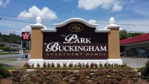 an apartment complex sign reading the park at buckingham